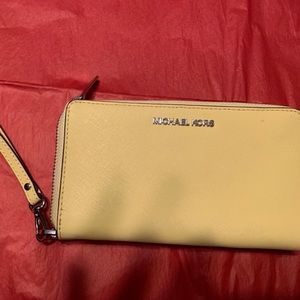 Michael Kors yellow wristlet.